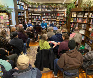 photo from River Lights Bookstore in Dubuque showing two dozen attendees for Tuesday author talk on 'Homesick'